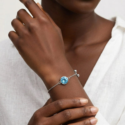 blue topaz birthstone bracelet in white gold finish — model view