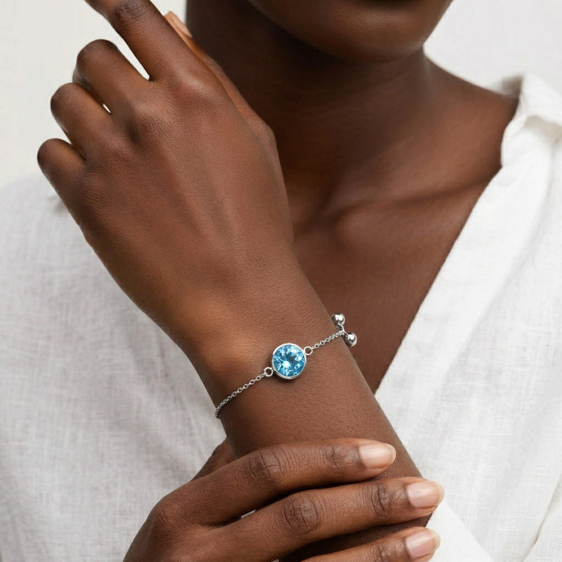 blue topaz birthstone bracelet in white gold finish — model view