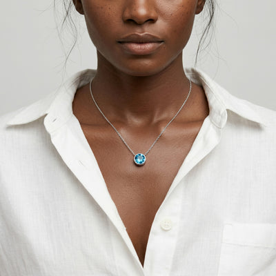 blue topaz birthstone necklace in white gold finish — model view