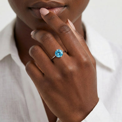blue topaz birthstone ring in white gold finish — model view