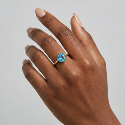blue topaz birthstone ring in yellow gold finish — model view