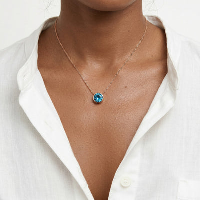 blue topaz birthstone necklace in rose gold finish — model view