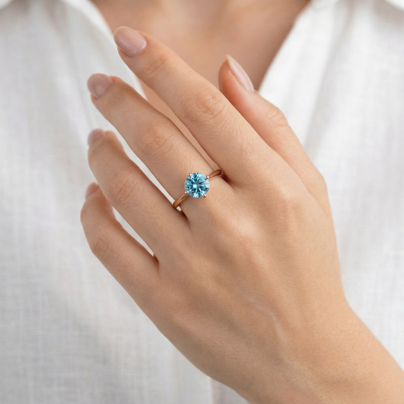 blue topaz birthstone ring in rose gold finish — model view
