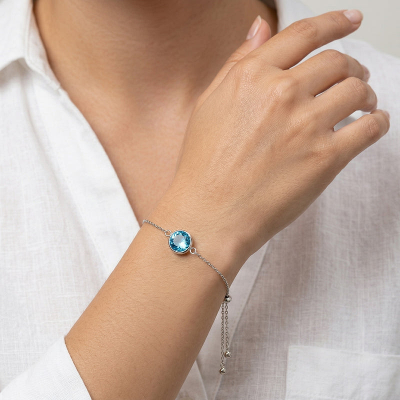 blue topaz birthstone bracelet in white gold finish — model view