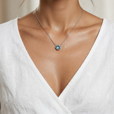 blue topaz birthstone necklace in white gold finish — model view