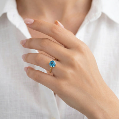 blue topaz birthstone ring in yellow gold finish — model view