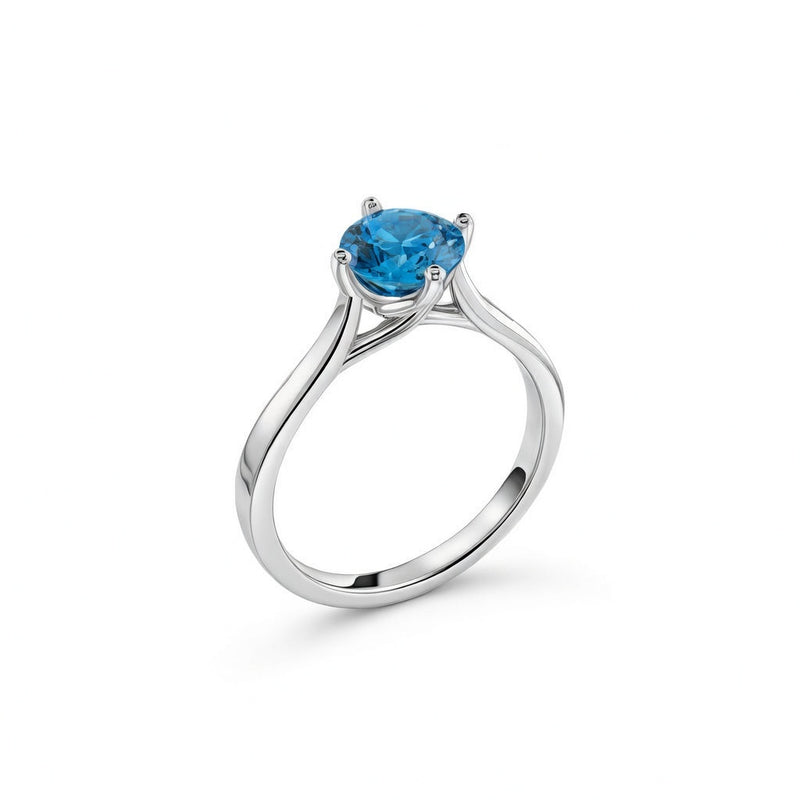 blue topaz birthstone ring in white gold finish — side view