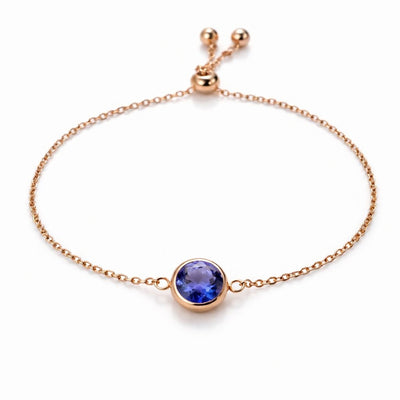 tanzanite birthstone bracelet in rose gold finish — front view
