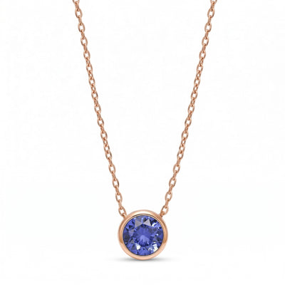 tanzanite birthstone necklace in rose gold finish — front view
