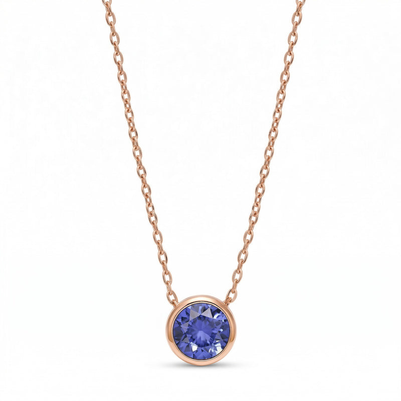 tanzanite birthstone necklace in rose gold finish — front view