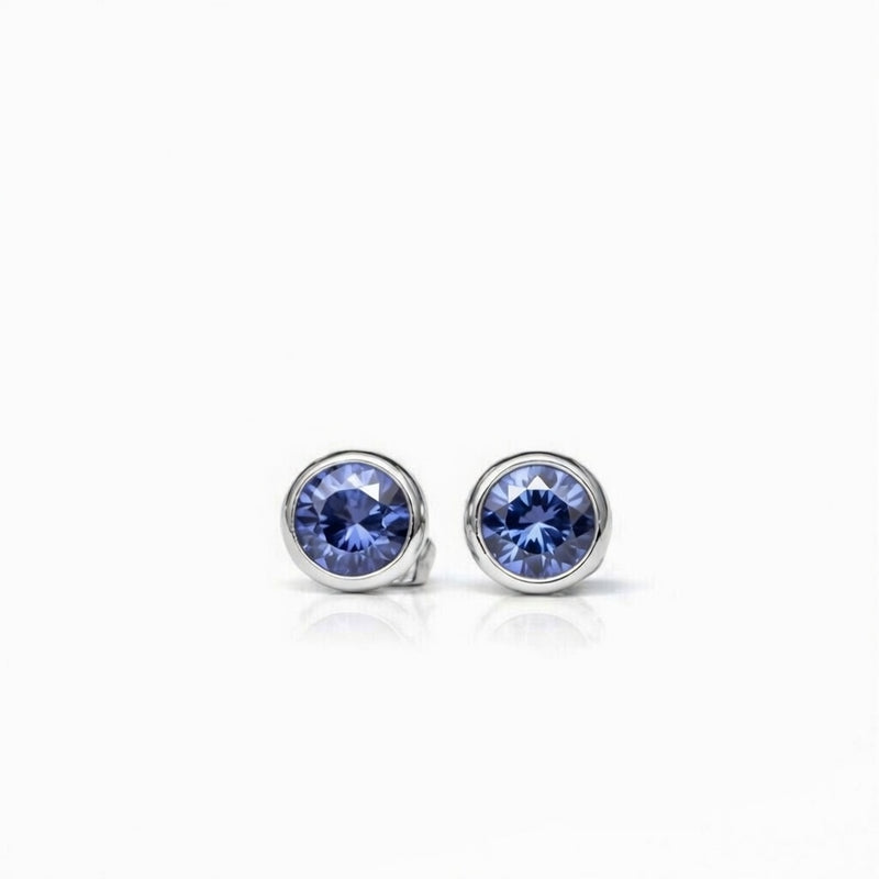 tanzanite birthstone stud earrings in white gold finish — front view
