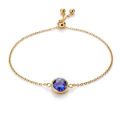 tanzanite birthstone bracelet in yellow gold finish — front view