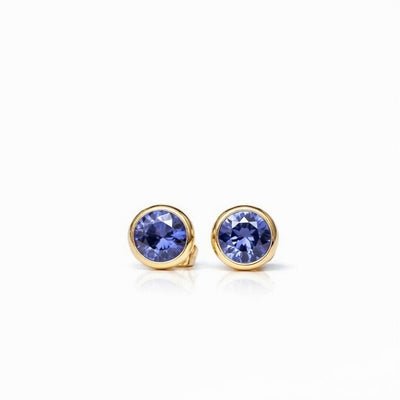 tanzanite birthstone stud earrings in yellow gold finish — front view