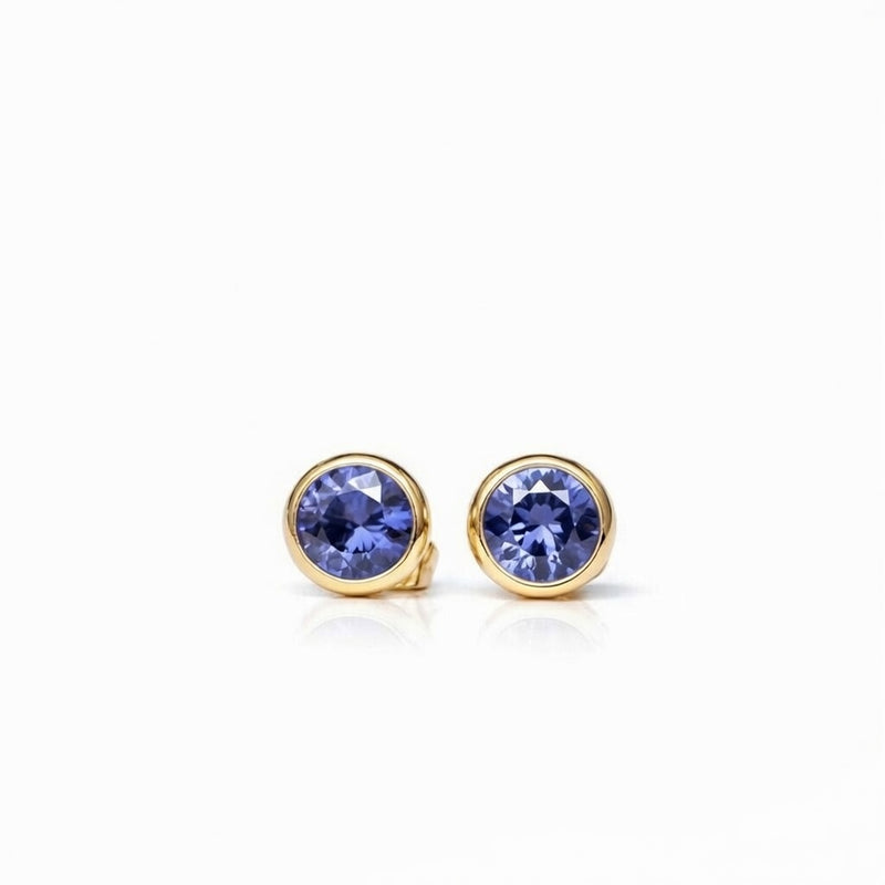 tanzanite birthstone stud earrings in yellow gold finish — front view
