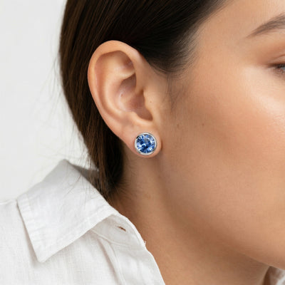 tanzanite birthstone stud earrings in white gold finish — model view