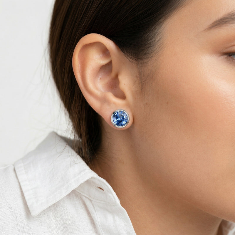 tanzanite birthstone stud earrings in white gold finish — model view