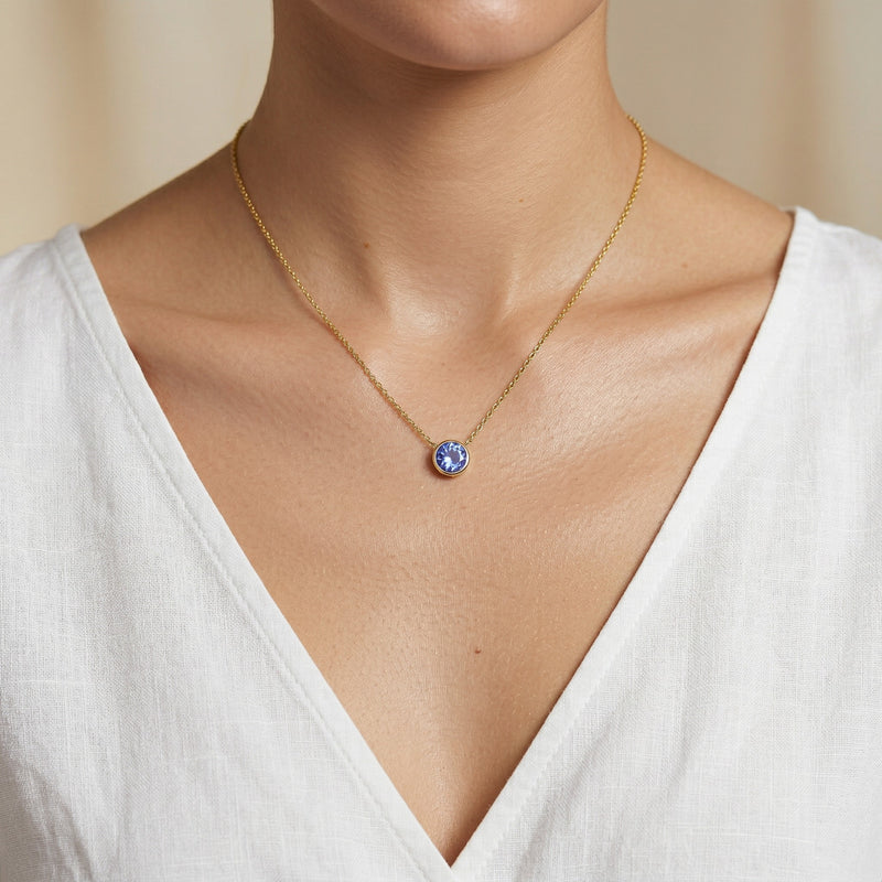 tanzanite birthstone necklace in yellow gold finish — model view