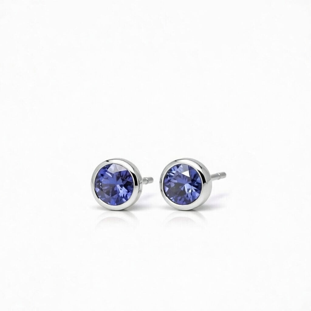 tanzanite birthstone stud earrings in white gold finish — side view