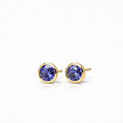 tanzanite birthstone stud earrings in yellow gold finish — side view