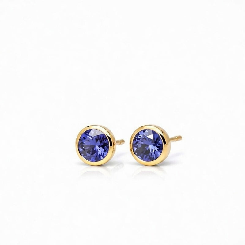 tanzanite birthstone stud earrings in yellow gold finish — side view