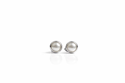 pearl birthstone stud earrings in white gold finish — front view