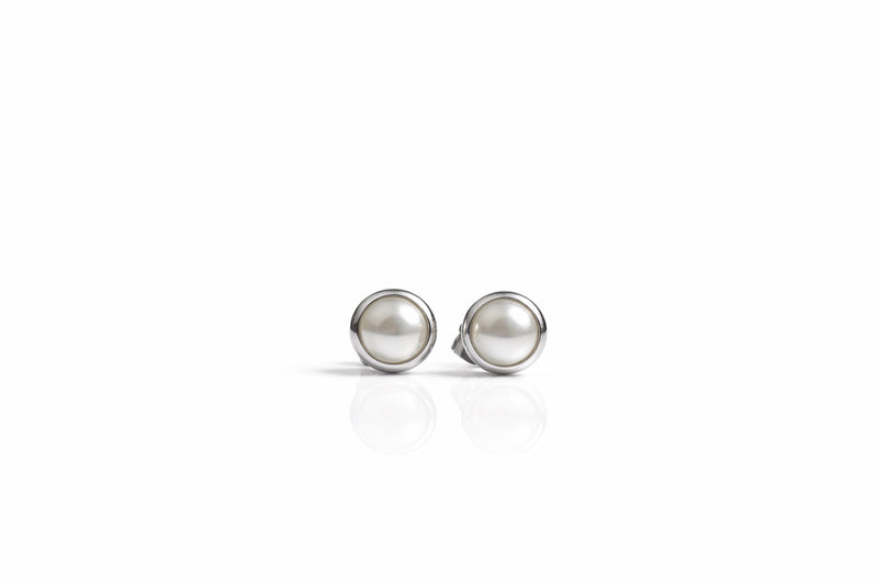 pearl birthstone stud earrings in white gold finish — front view