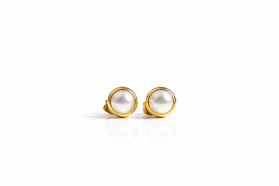 pearl birthstone stud earrings in yellow gold finish — front view