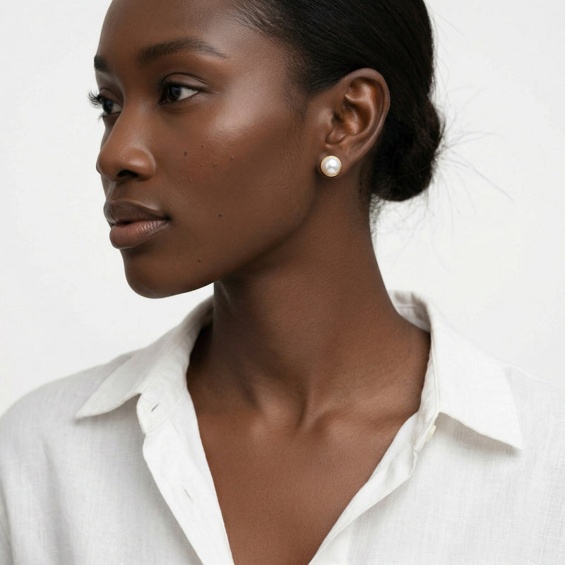 pearl birthstone stud earrings in yellow gold finish — model view