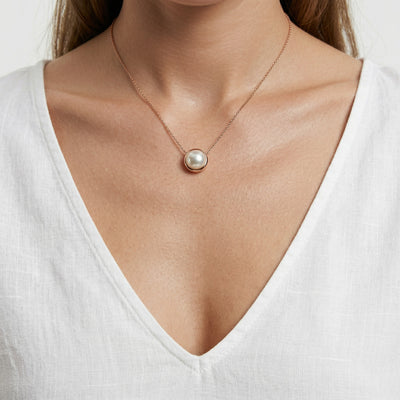 pearl birthstone necklace in rose gold finish — model view
