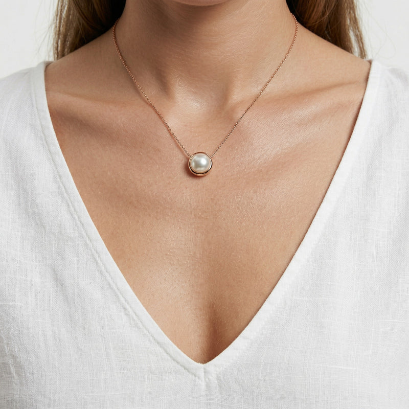 pearl birthstone necklace in rose gold finish — model view