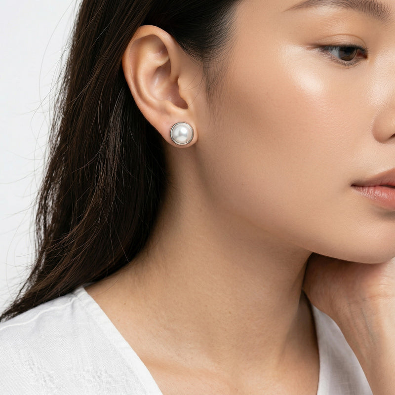 pearl birthstone stud earrings in white gold finish — model view
