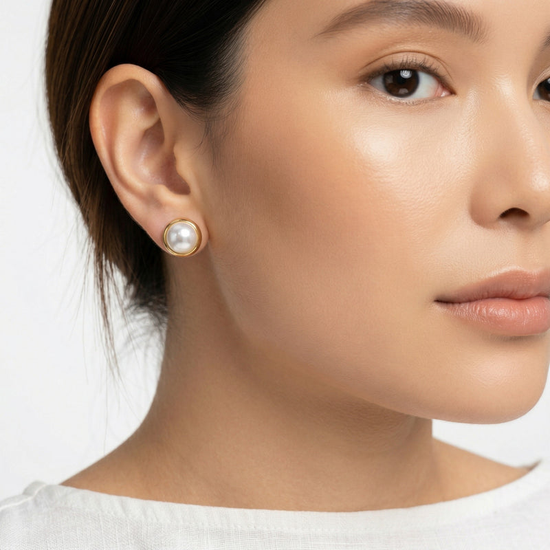pearl birthstone stud earrings in yellow gold finish — model view