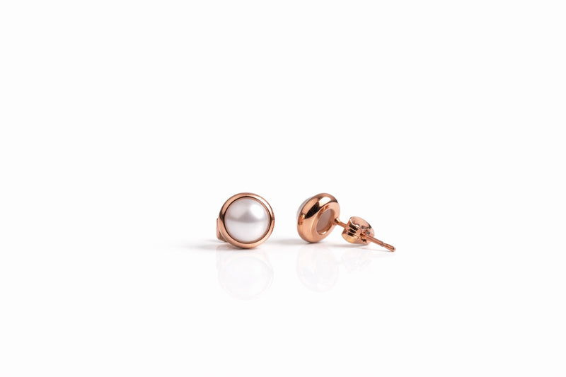 pearl birthstone stud earrings in rose gold finish — side view