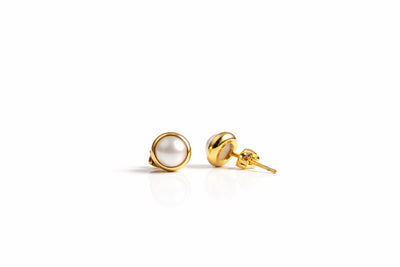 pearl birthstone stud earrings in yellow gold finish — side view