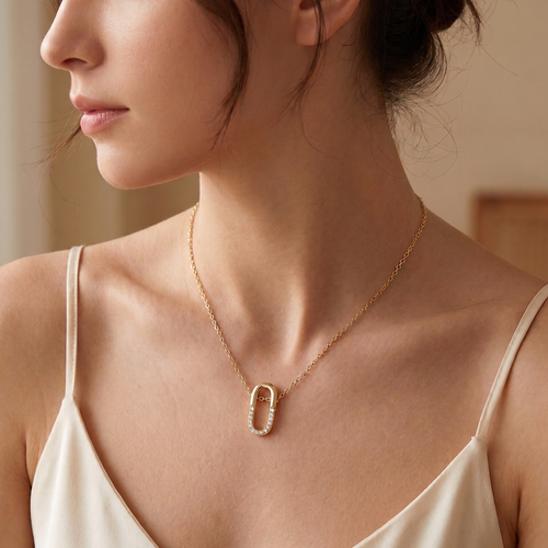 oval pavé pendant necklace in yellow gold finish — model view