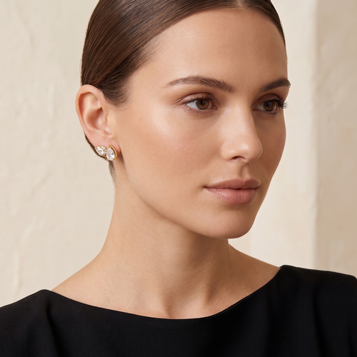 white teardrop climber earrings in yellow gold finish — model view