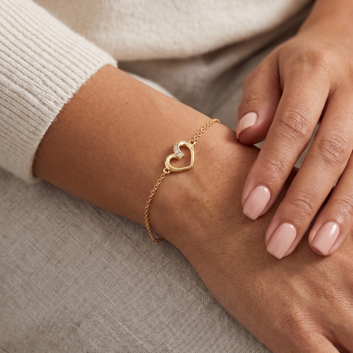 twisted heart bracelet in yellow gold finish — model view