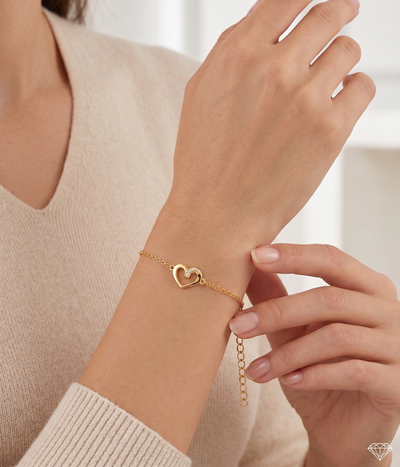 twisted heart bracelet in yellow gold finish — model view