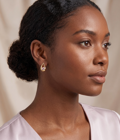 teardrop alexandrite stud earrings in yellow gold finish — model view
