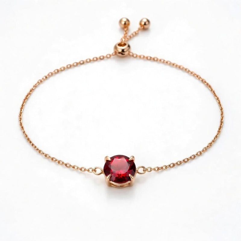 garnet birthstone bracelet in rose gold finish — front view
