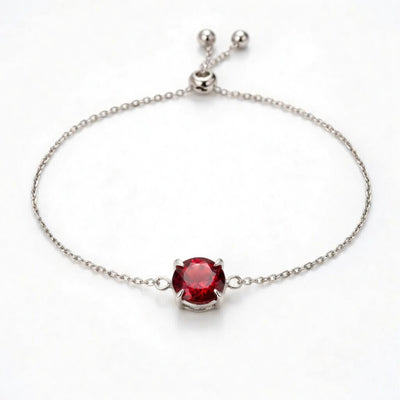 garnet birthstone bracelet in white gold finish — front view