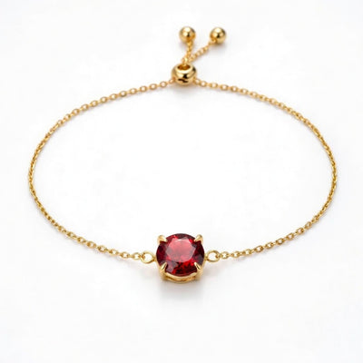 garnet birthstone bracelet in yellow gold finish — front view