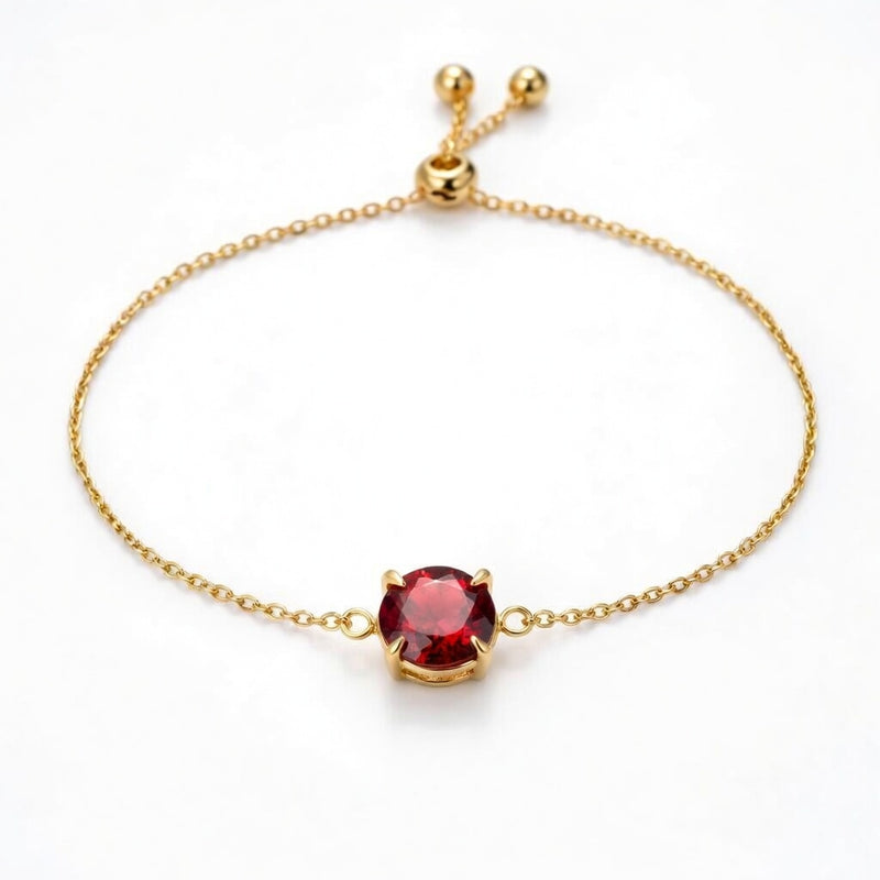 garnet birthstone bracelet in yellow gold finish — front view