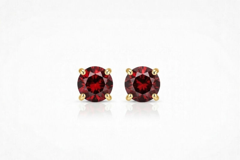garnet birthstone stud earrings in yellow gold finish — front view
