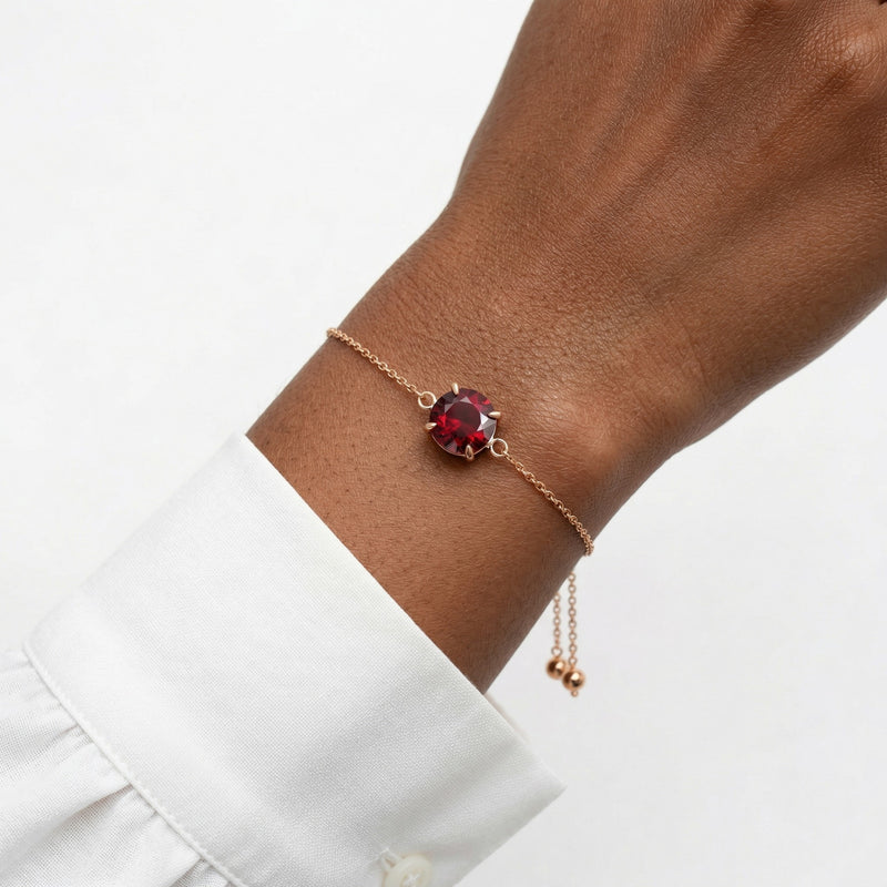 garnet birthstone bracelet in rose gold finish — model view