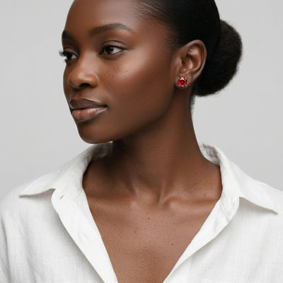 garnet birthstone stud earrings in rose gold finish — model view