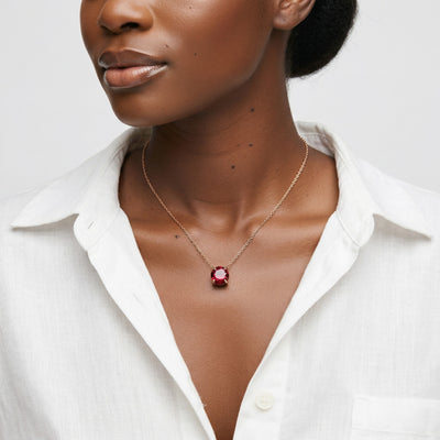garnet birthstone necklace in rose gold finish — model view