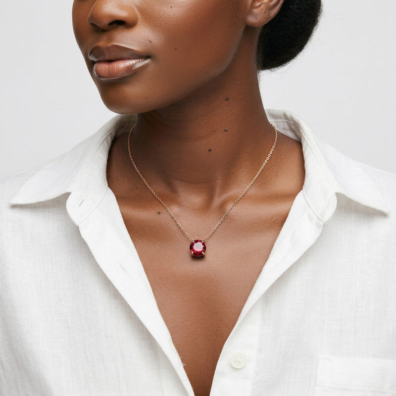 garnet birthstone necklace in rose gold finish — model view