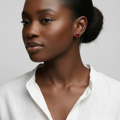 garnet birthstone stud earrings in white gold finish — model view
