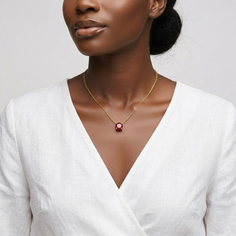 garnet birthstone necklace in yellow gold finish — model view